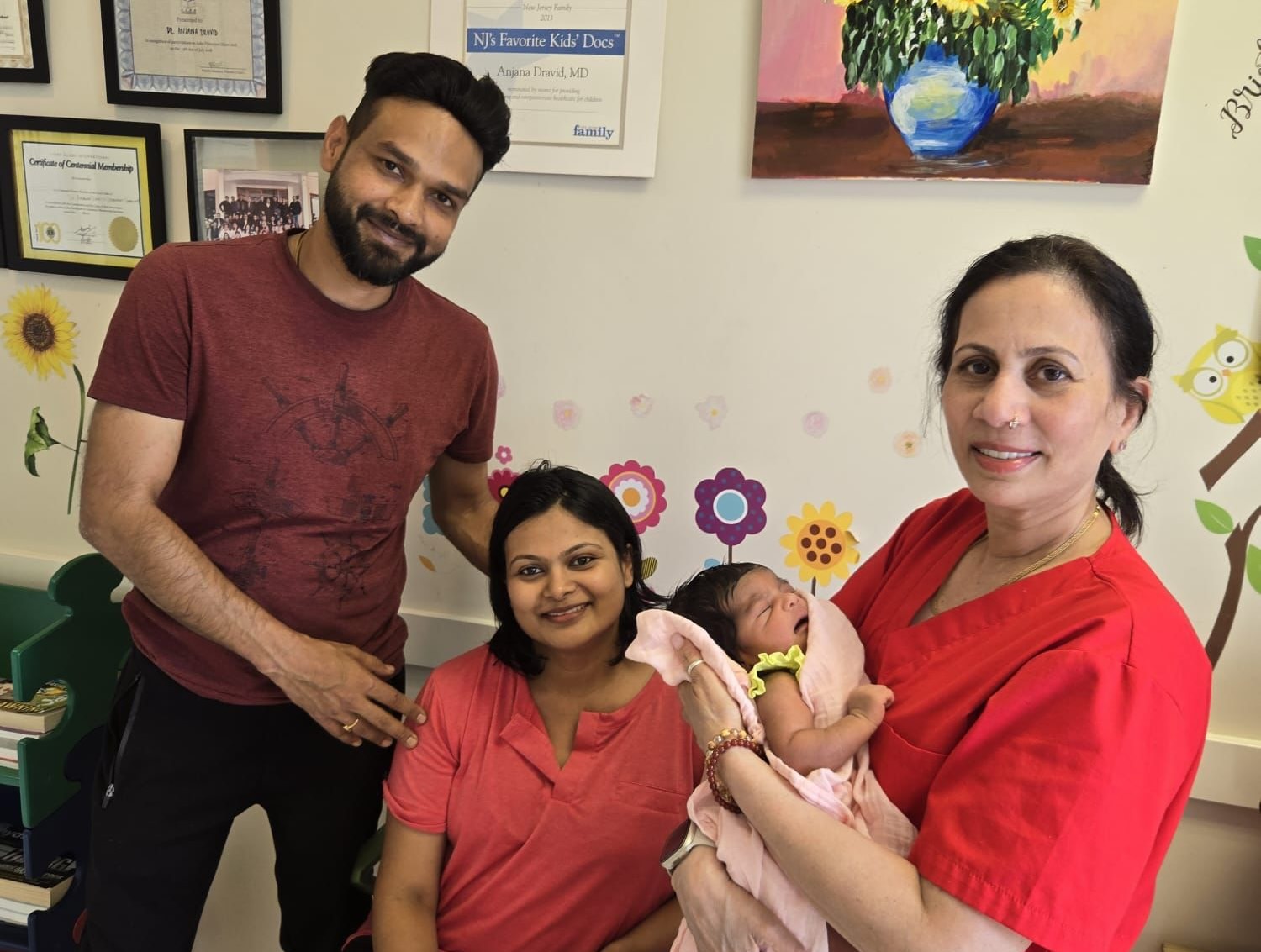 Happy family with newborn baby receiving compassionate care from pediatric healthcare professional at Excel Pediatrics